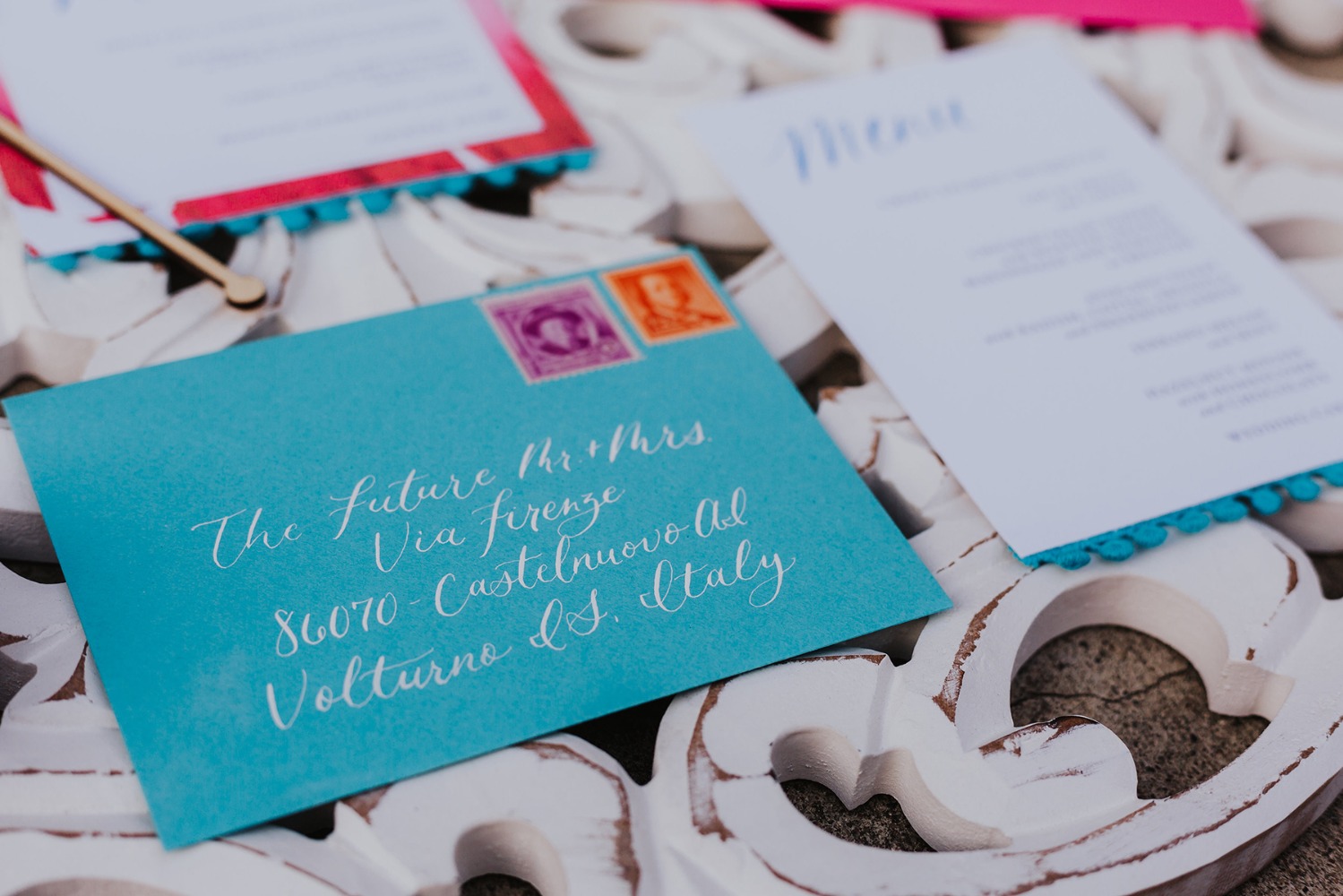 Wedding invitation with turquoise envelope and calligraphy