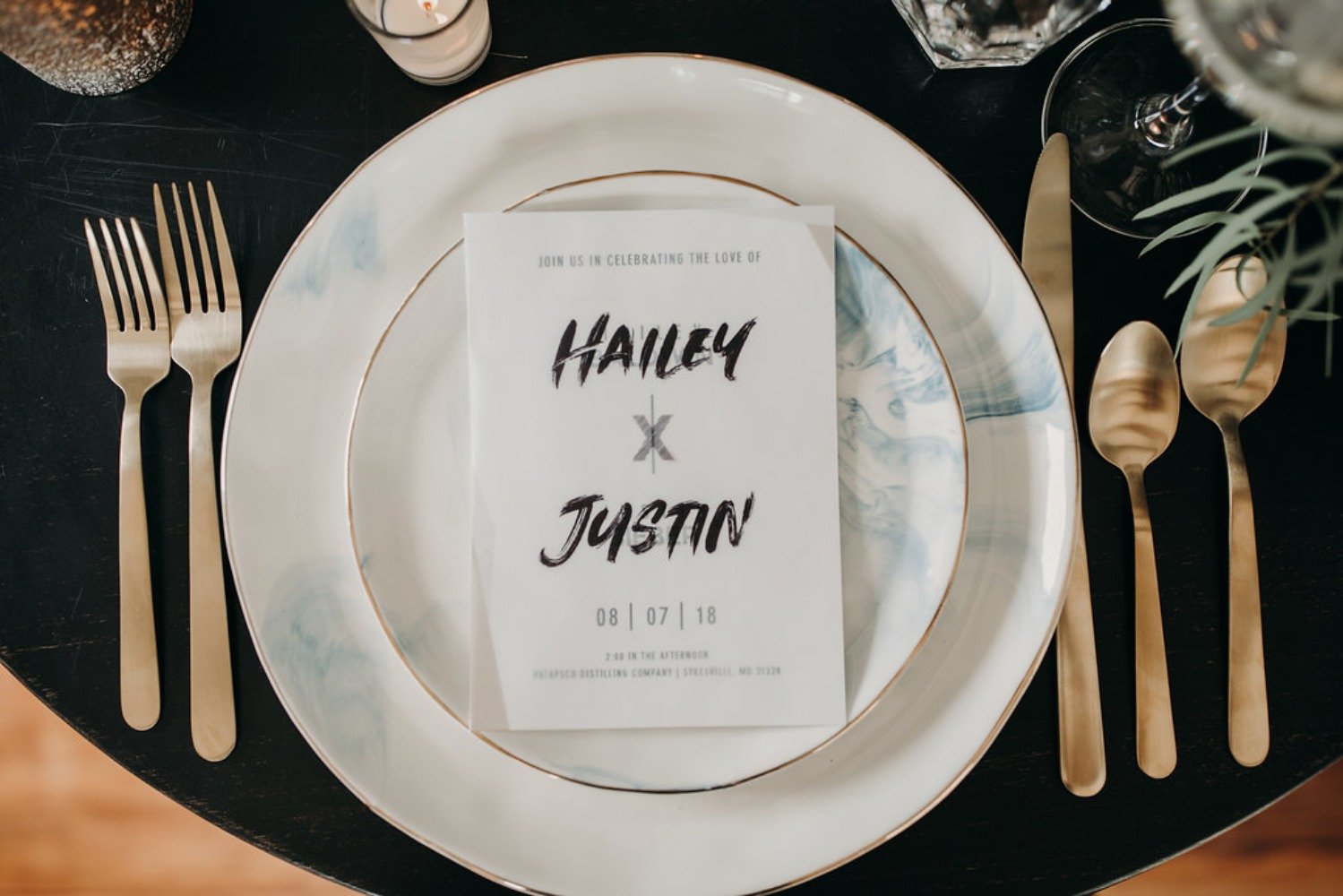 modern gold and black wedding place setting