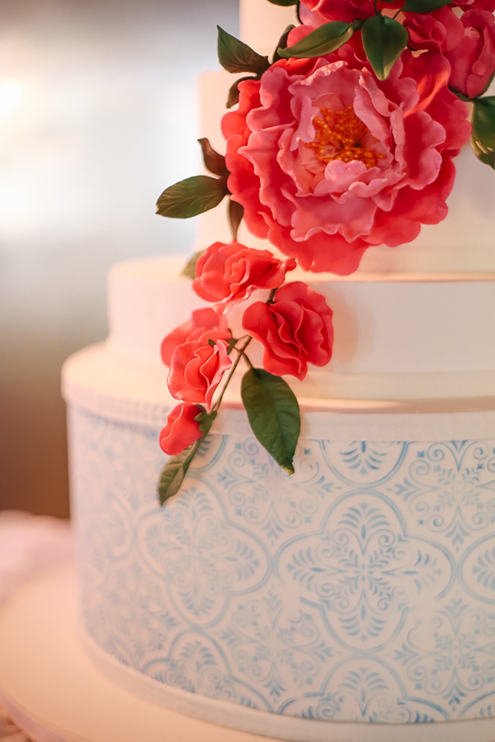 stamped wedding cake with flower accents