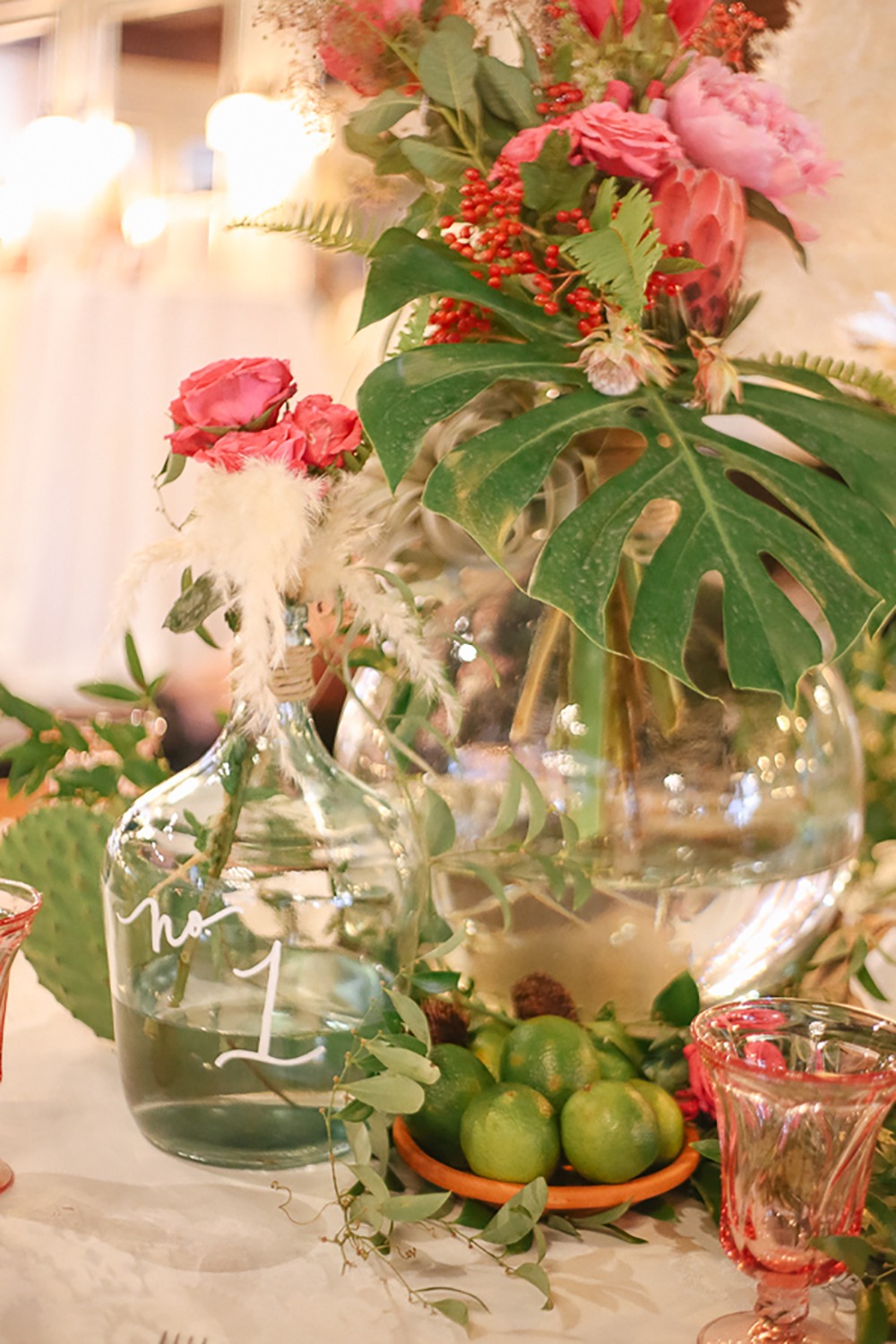 tropical and whimsical table number and centerpiece idea