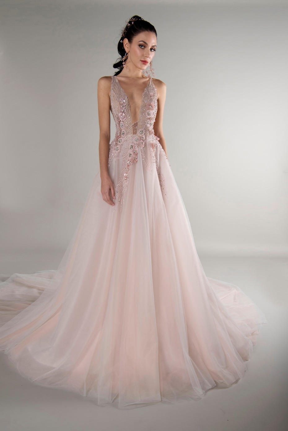 Elegant woman wearing a blush pink wedding dress