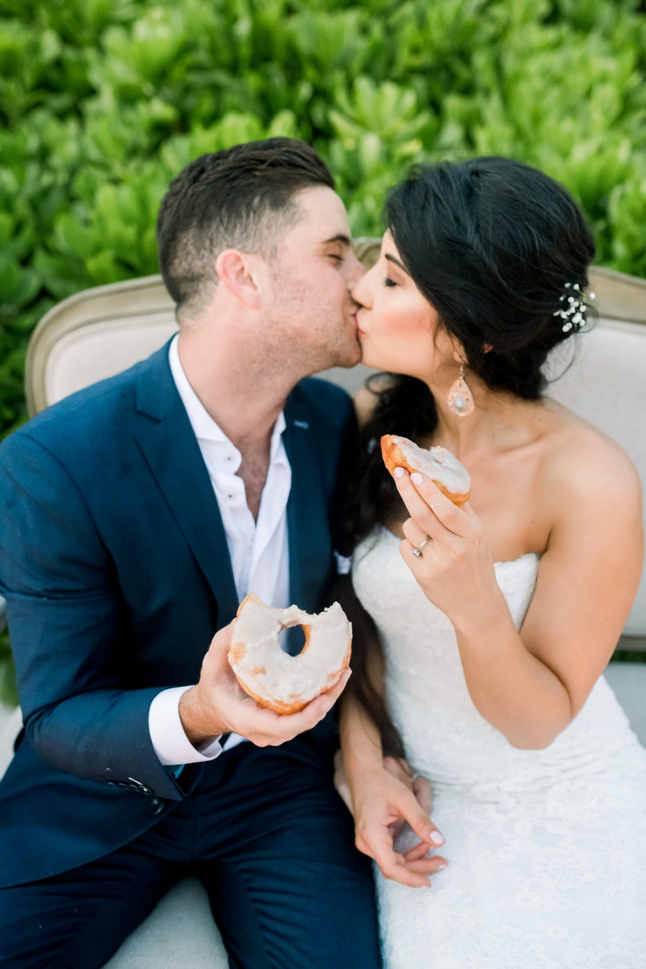 Cayman Island Beach Wedding Couple Kissing with Doughnuts