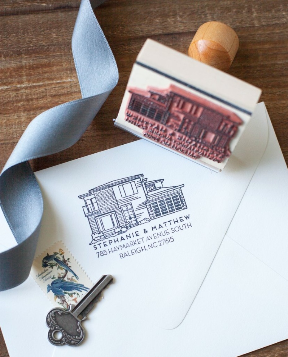 Custom house stamp on envelope with key and ribbon elements