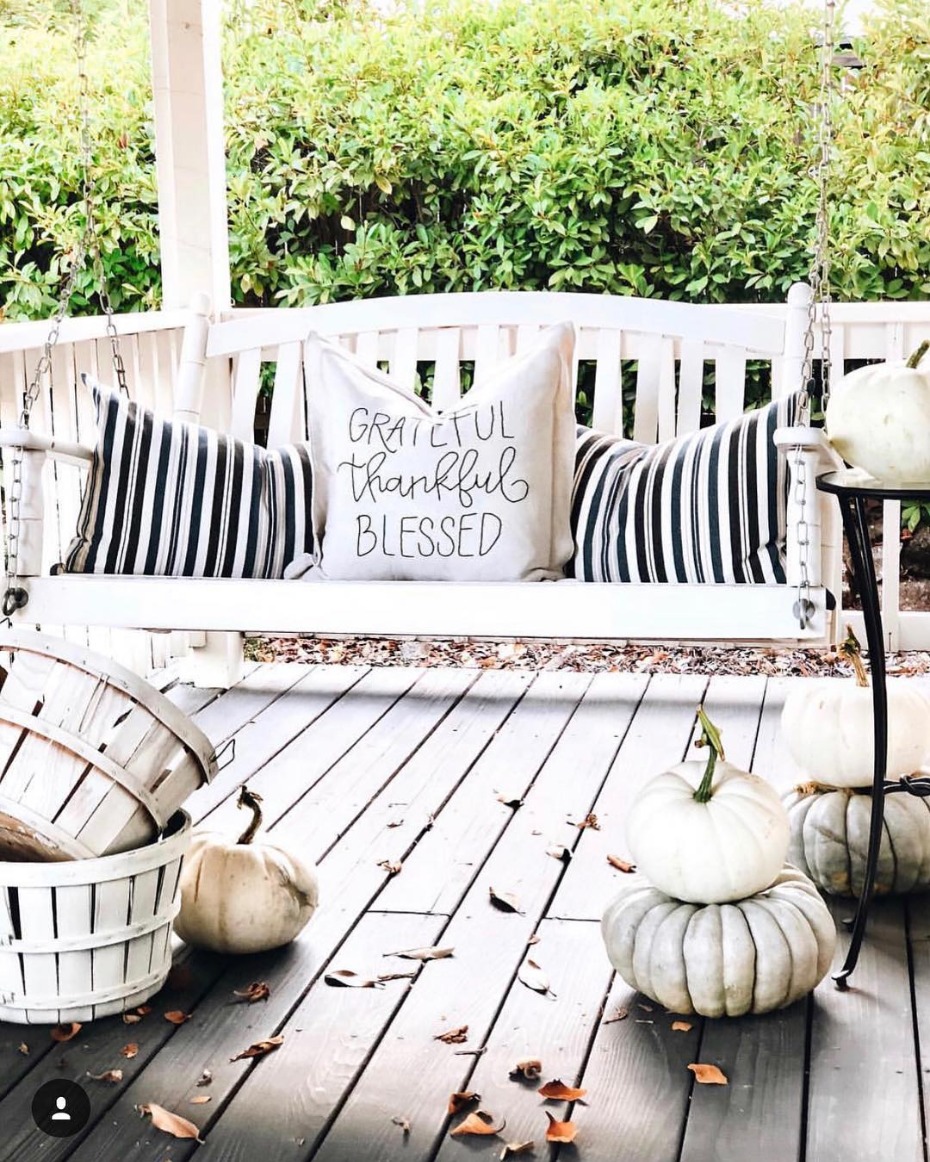 Black and white autumn porch with swing