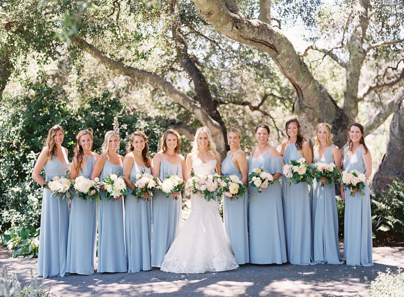 bridesmaids in full length sky blue dresses