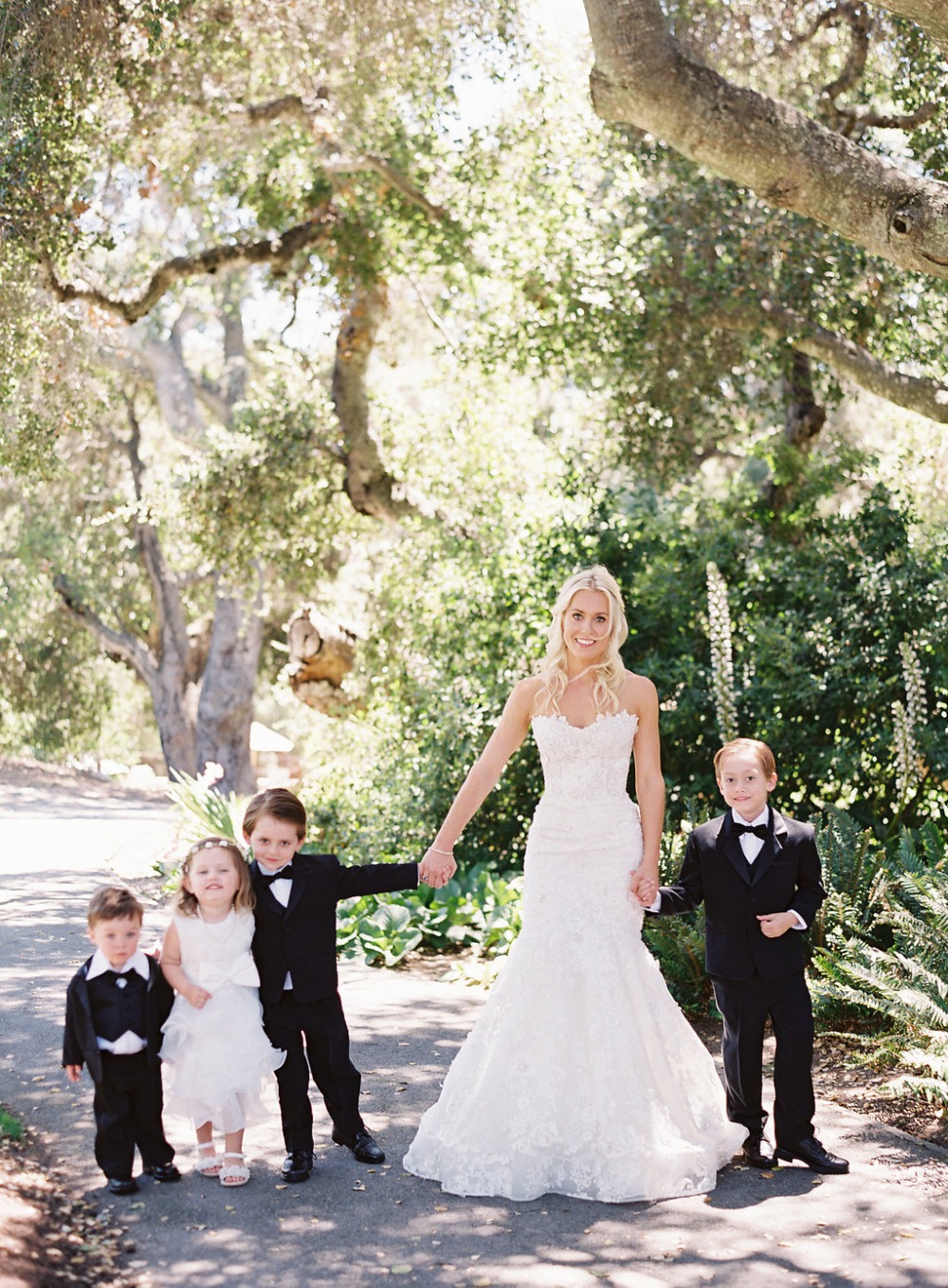 sweet bride and all her smallest wedding party members