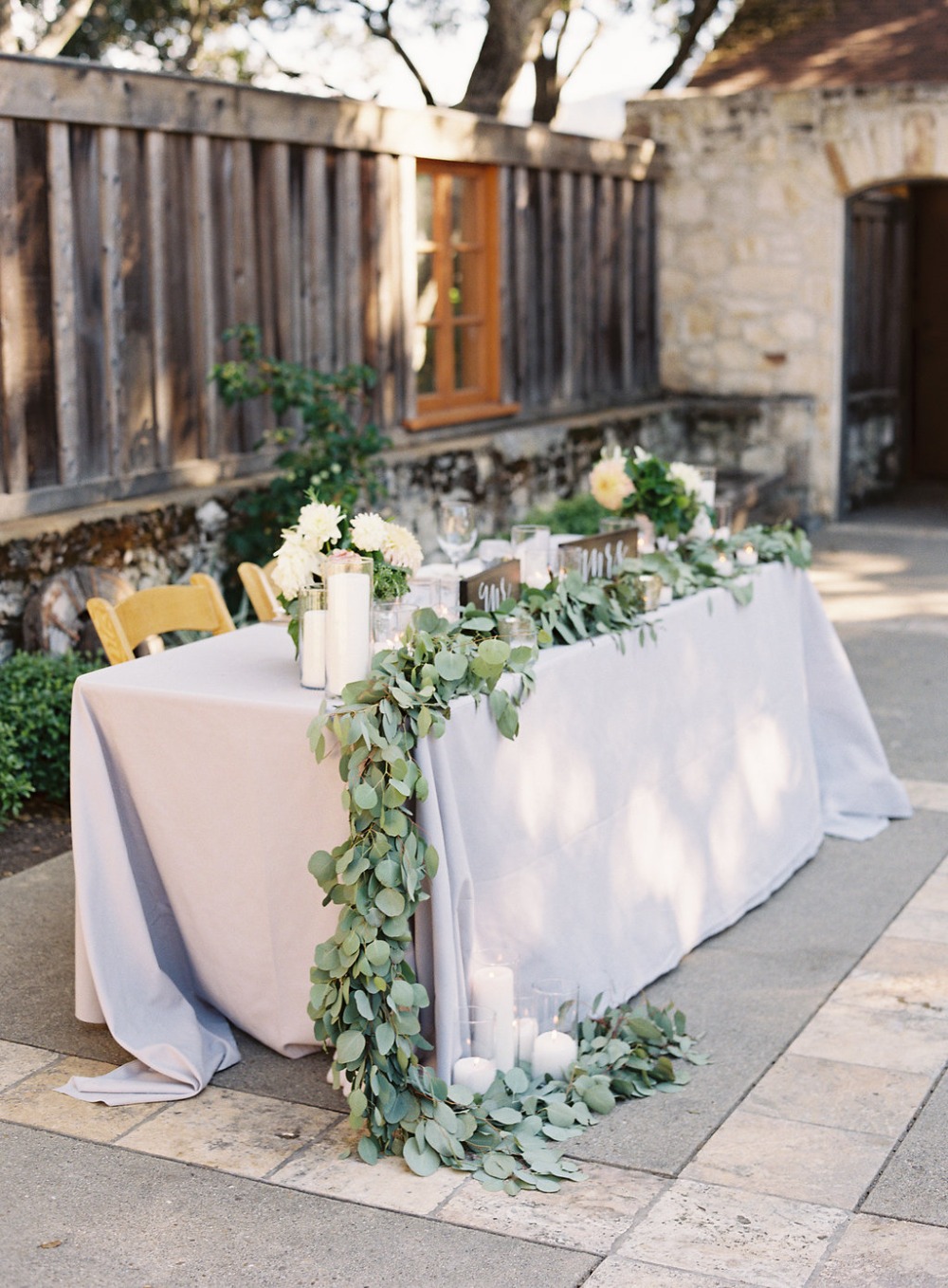 sweetheart table in grey and greenery