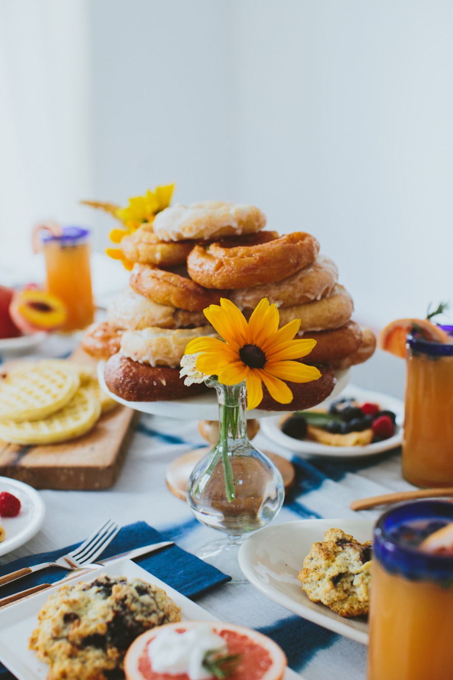 Brunch wedding reception donuts fresh flowers and tall mimosas