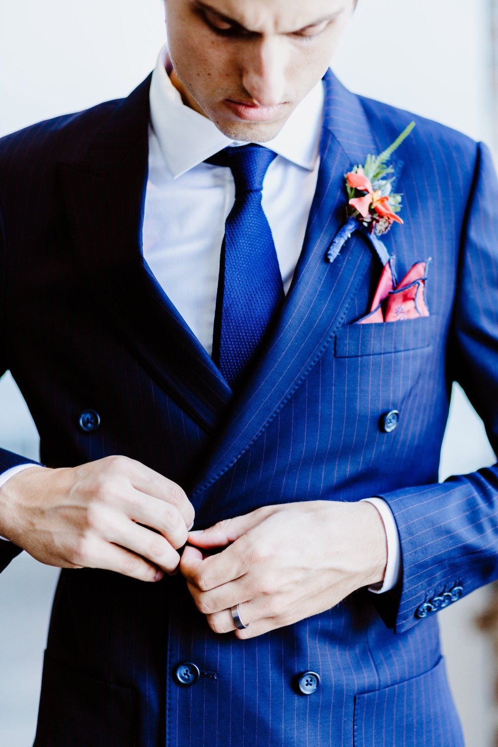 groom in navy double breasted pinstripe suit
