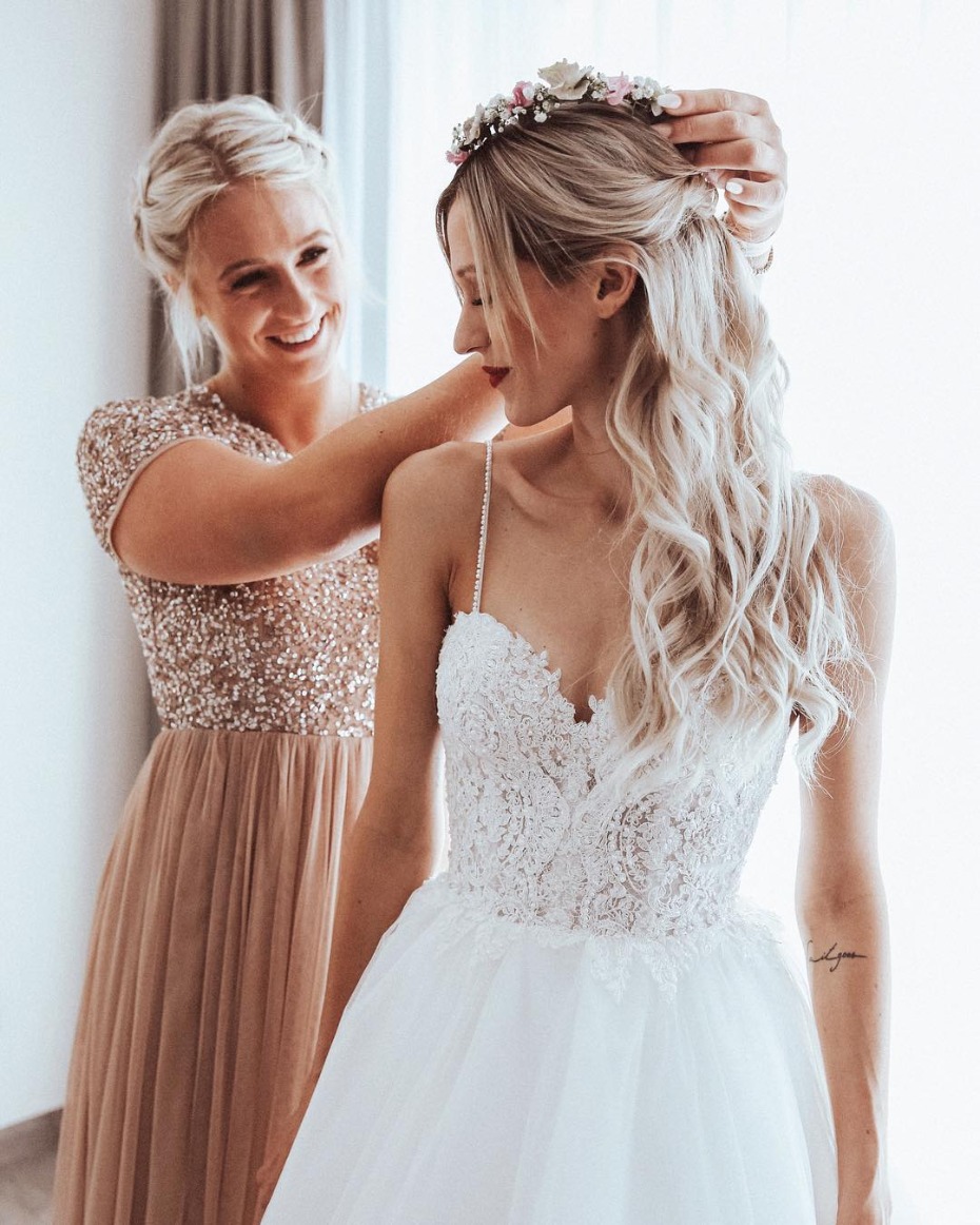 Maid of Honor Helping Bride Get Ready