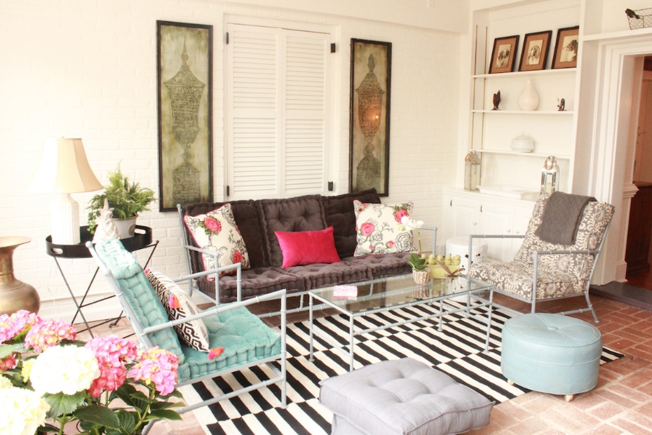 Stylish living room with tufted seating and striped rug