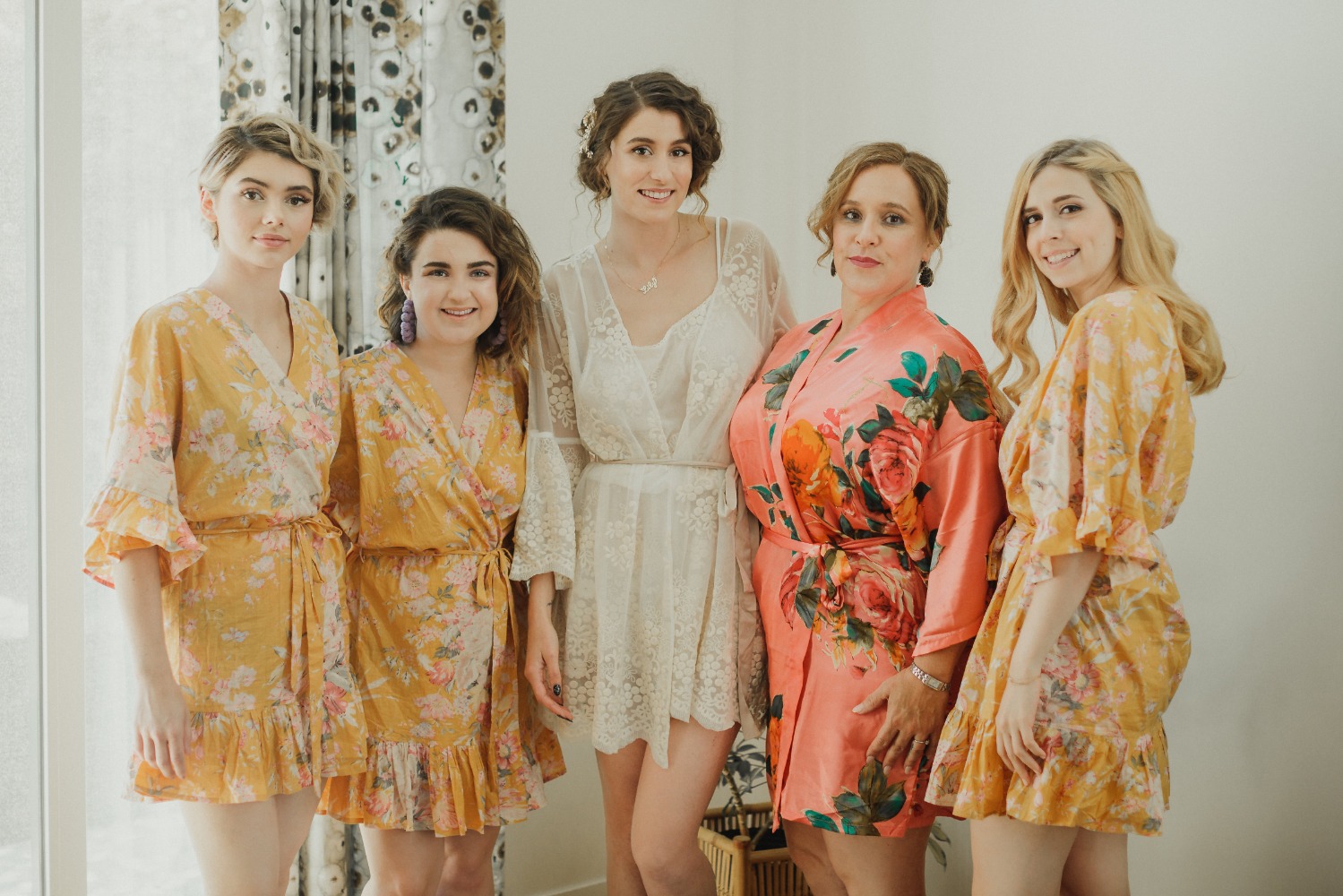bride and her bridesmaids getting ready robes