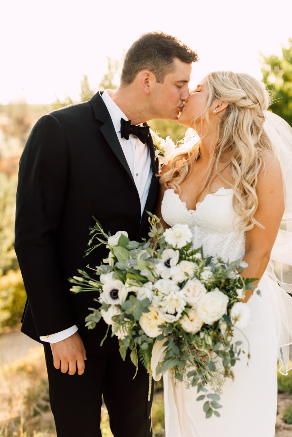 Bride and groom sharing a kiss on their wedding day