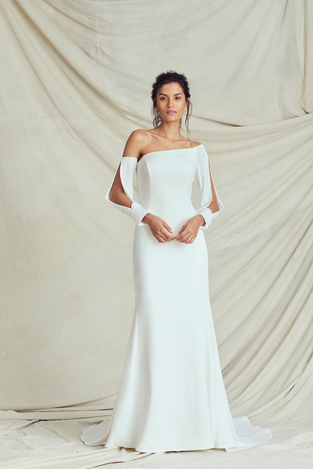 sleek gown with open sleeves by Kelly Faetanini