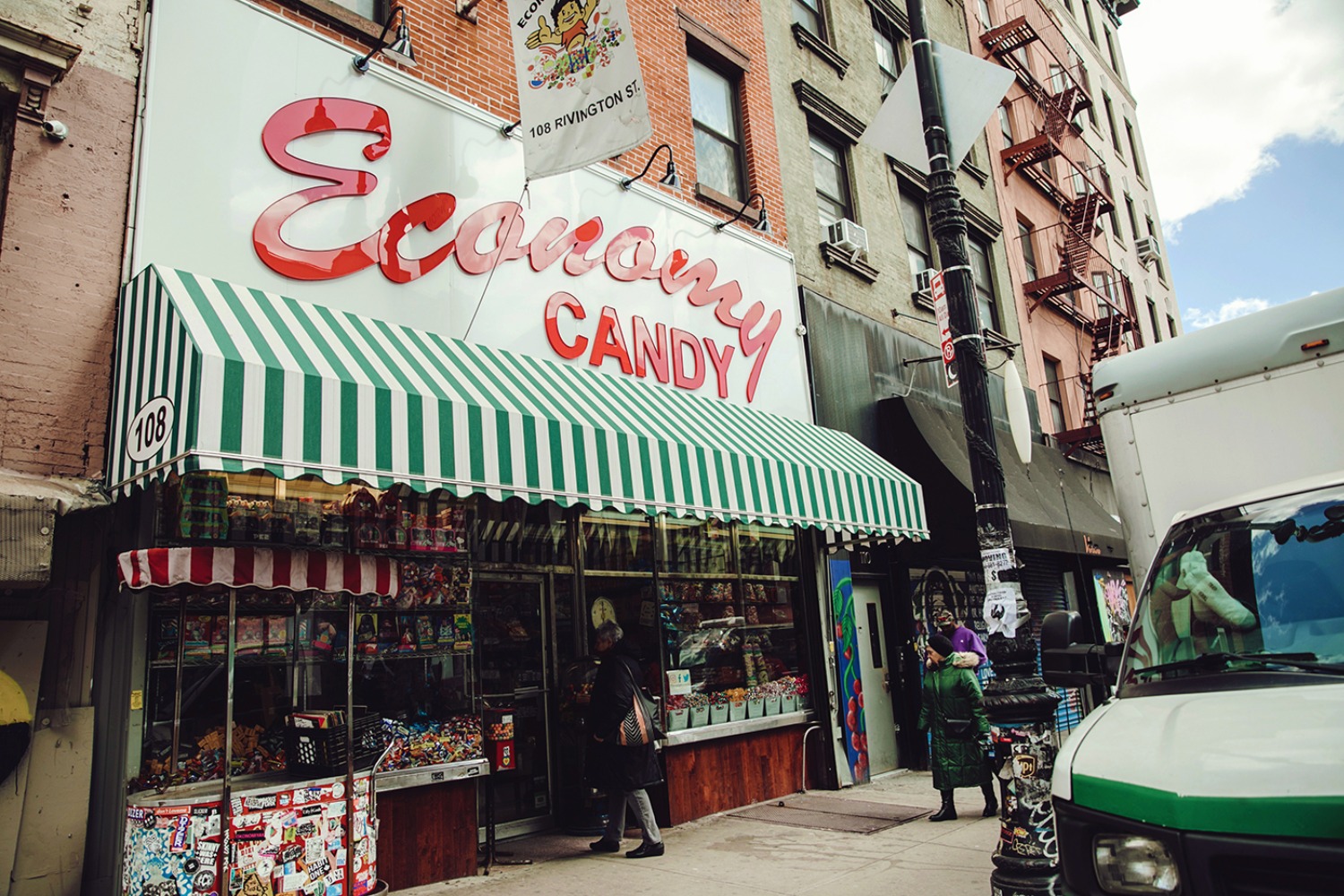 Economy Candy store in NYC with green and white striped awning