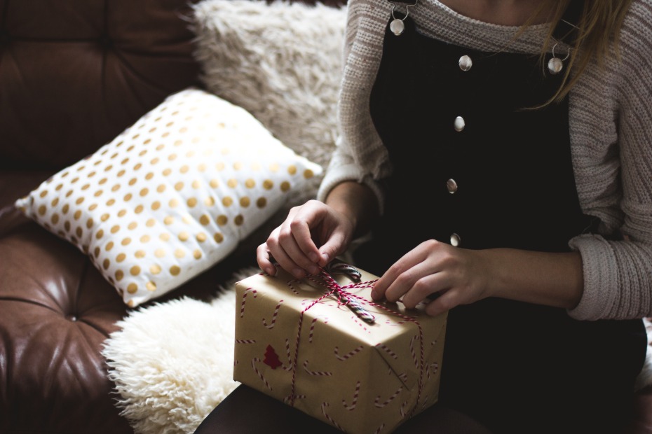 Woman sitting with Xmas present on lap