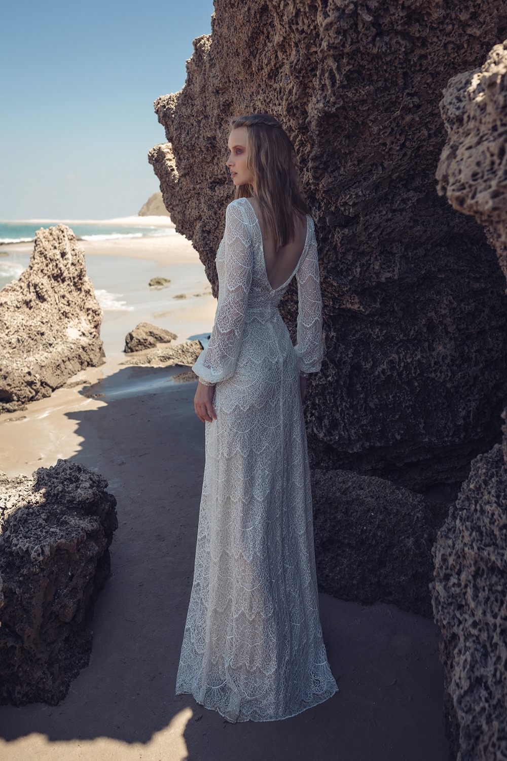 back showcasing full sleeved gown by Lilium