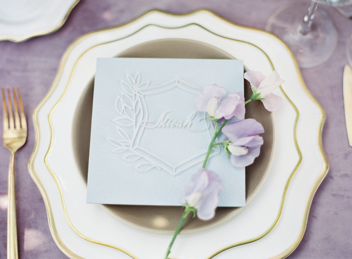 glam gold and lavender wedding place setting