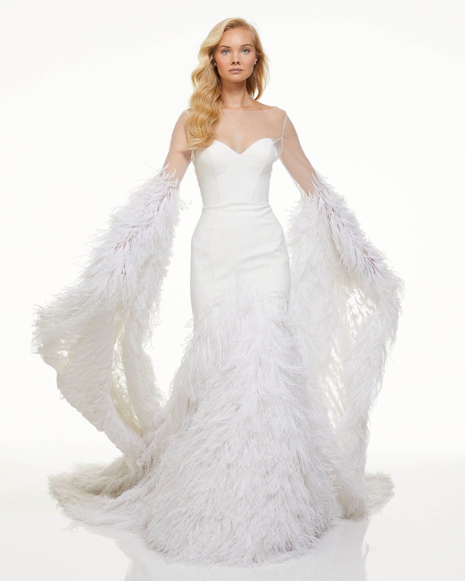 Elegant white feathered wedding dress with a flowing train