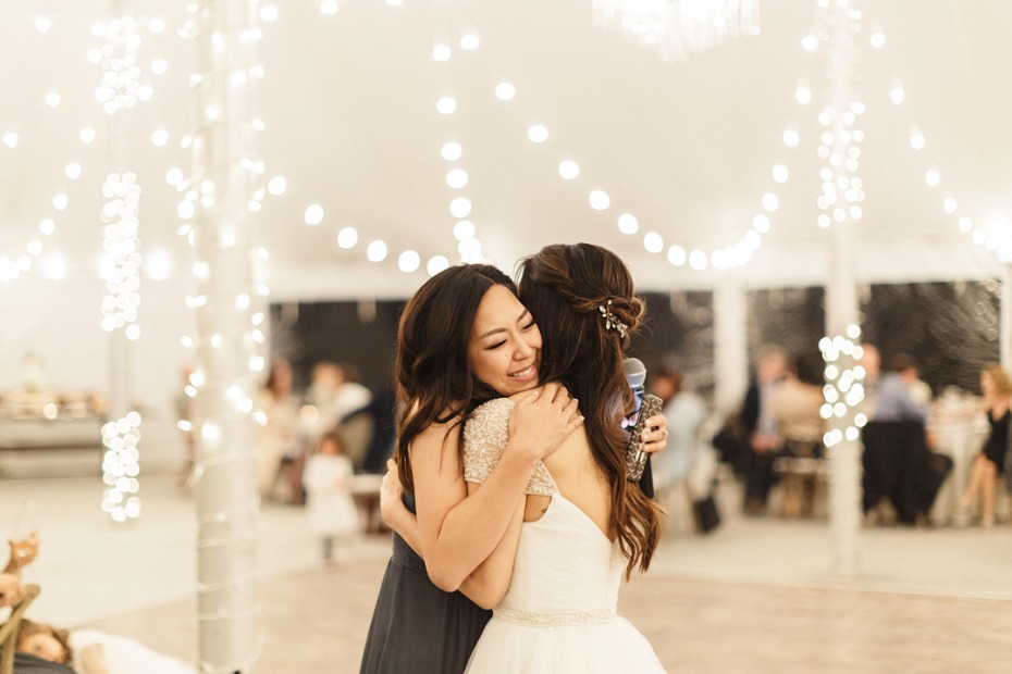 Maid of Honor Hugging Bride After Speech