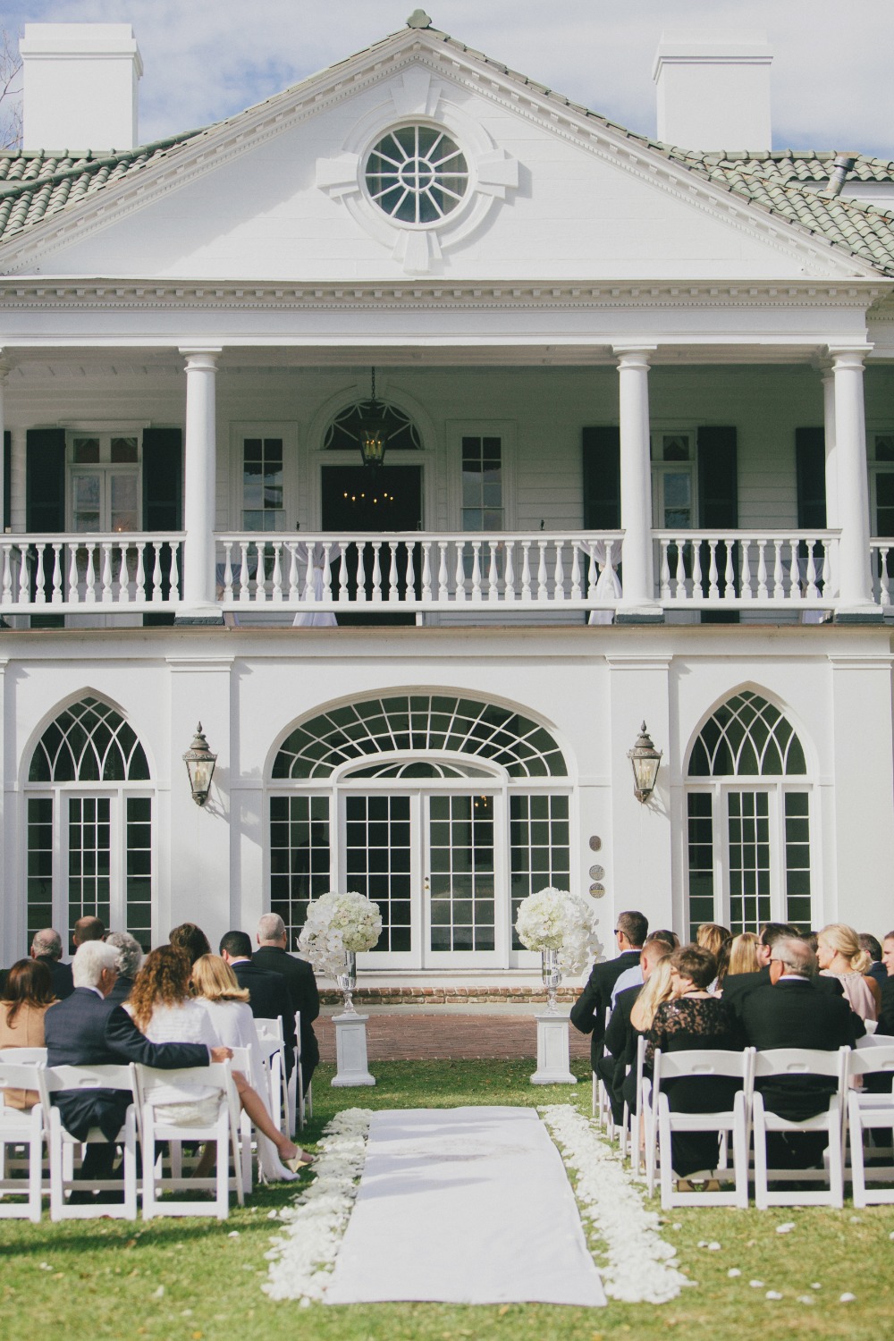 formal all white wedding ceremony outdoors