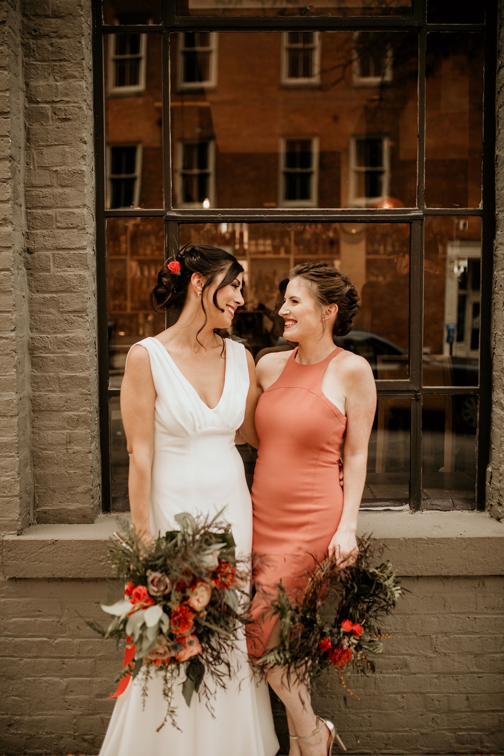 bride and her bridesmaid in coral