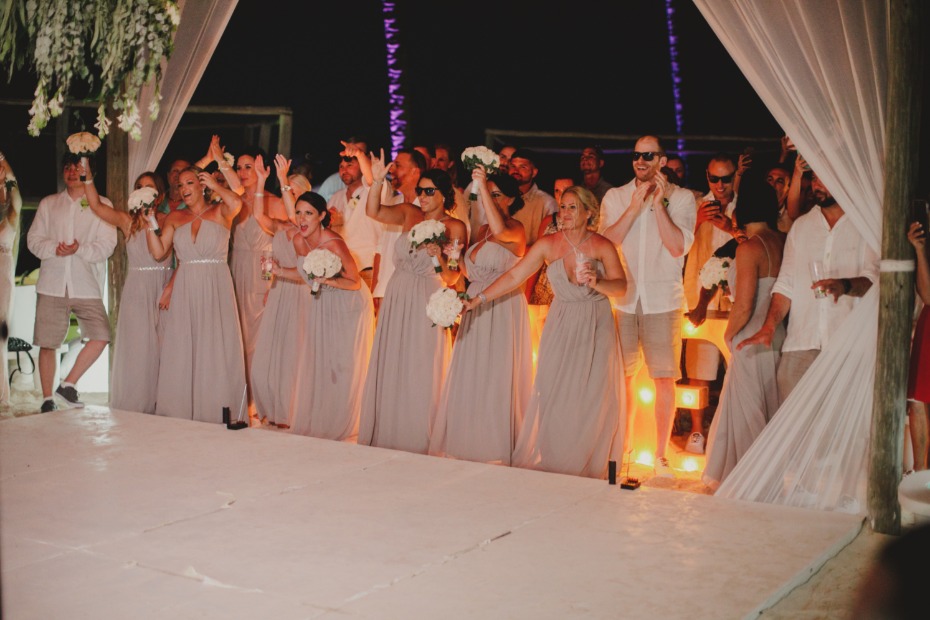 Wedding party celebrating on the dance floor at night