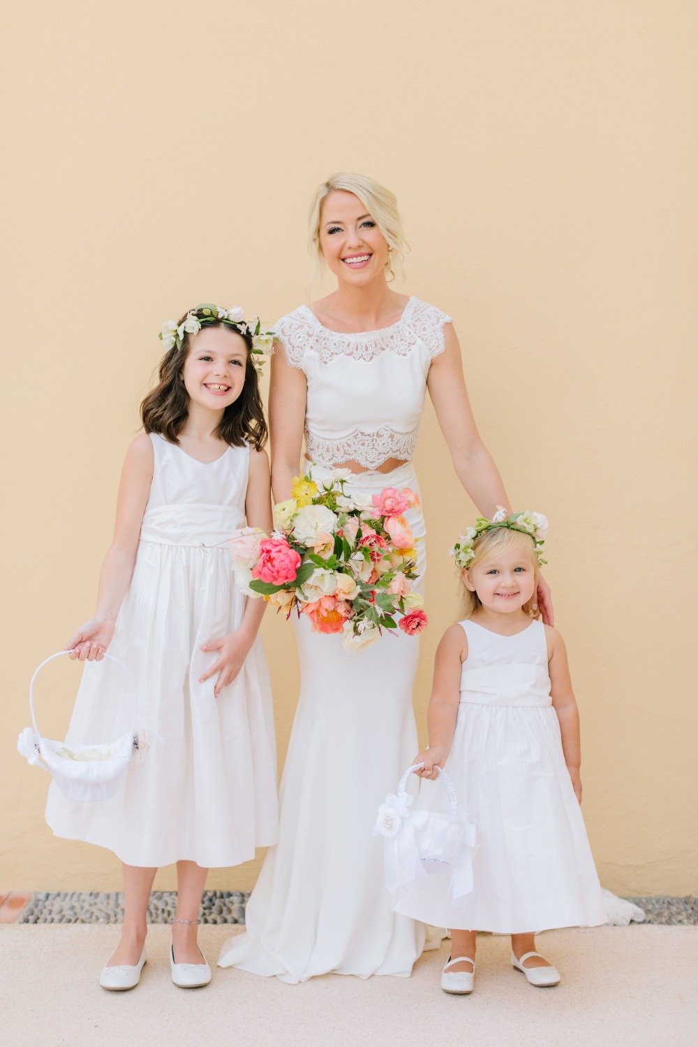 bride with her cute little flower girls