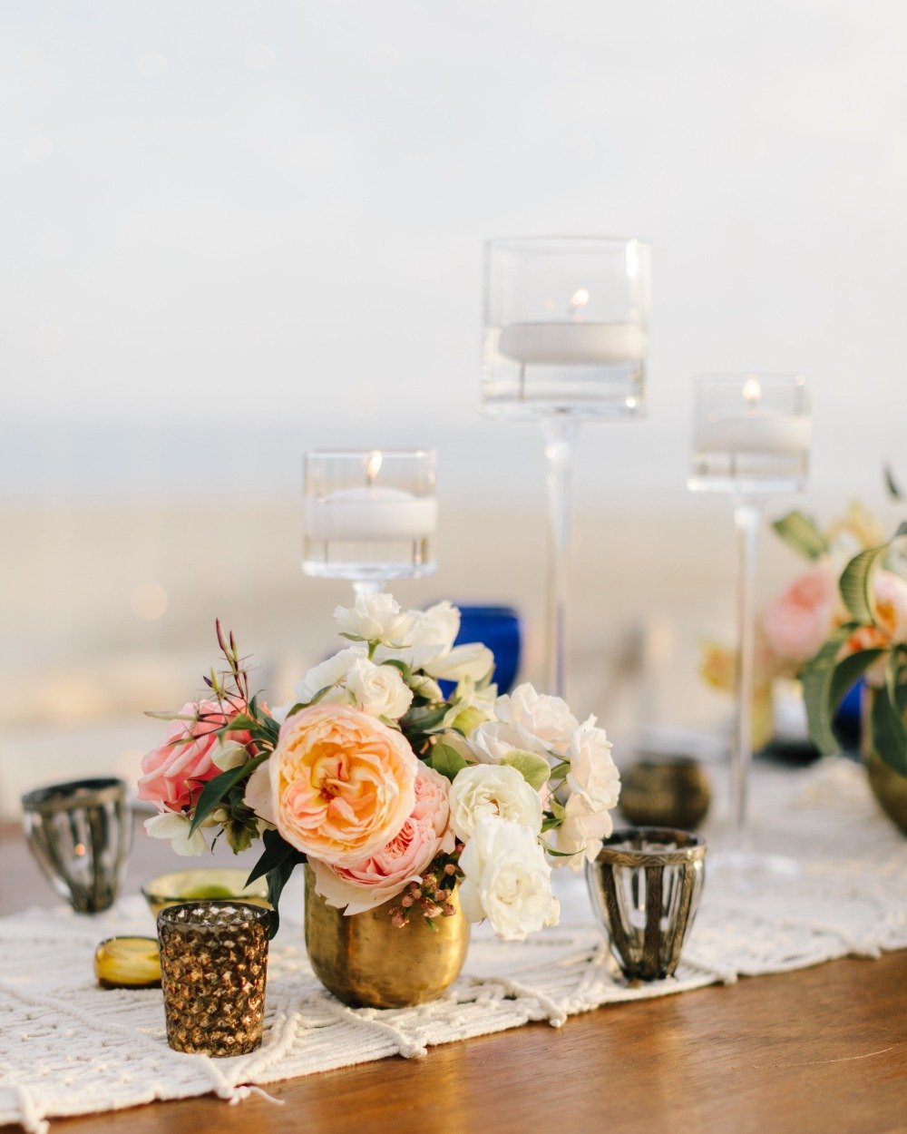 blush and gold centerpiece with floating candles
