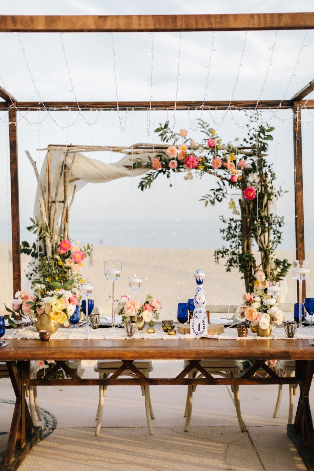 romantic sweetheart table idea with floral arch