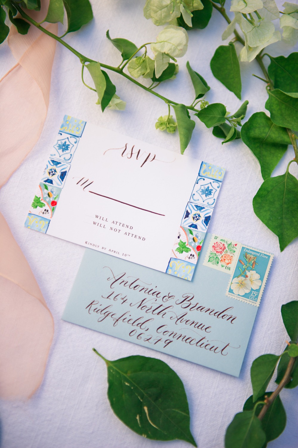 Elegant wedding invitation with RSVP card and floral design