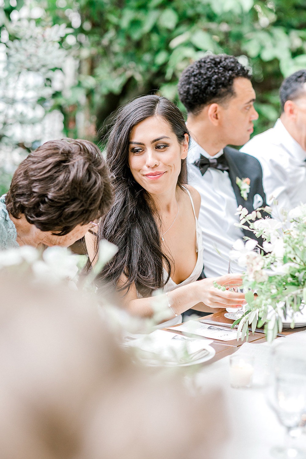 Beautiful woman smiles at a wedding reception, enjoying the company