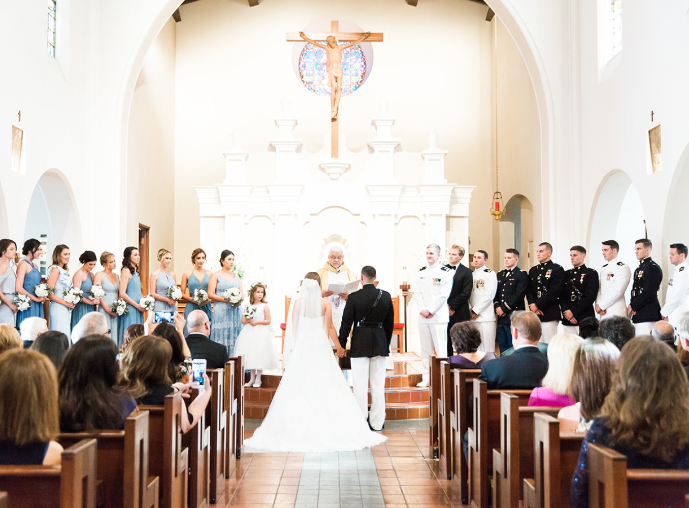 Wedding ceremony in a beautiful church with bridesmaids and groomsmen