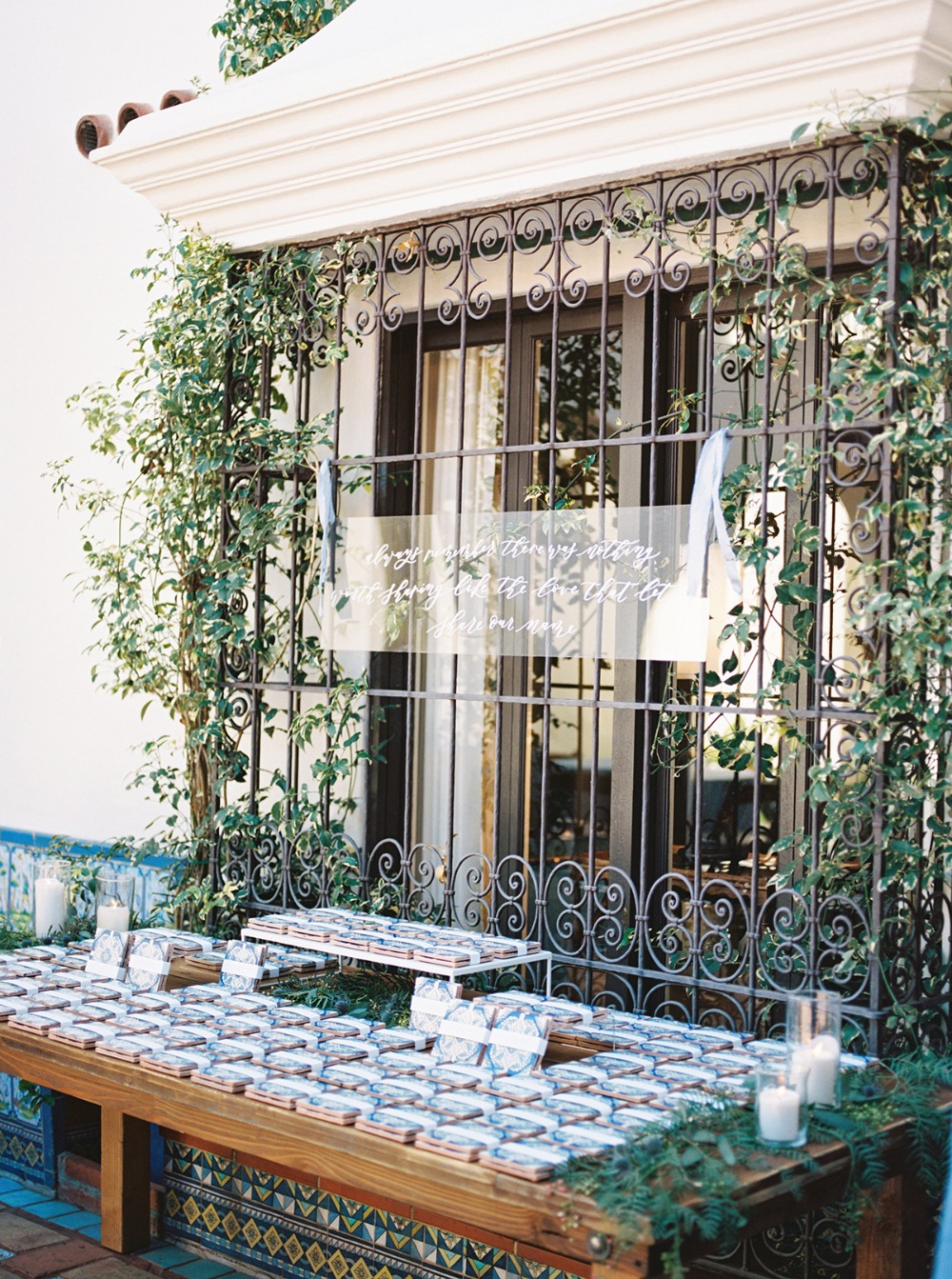 Wedding favors and a sign at outdoor reception venue