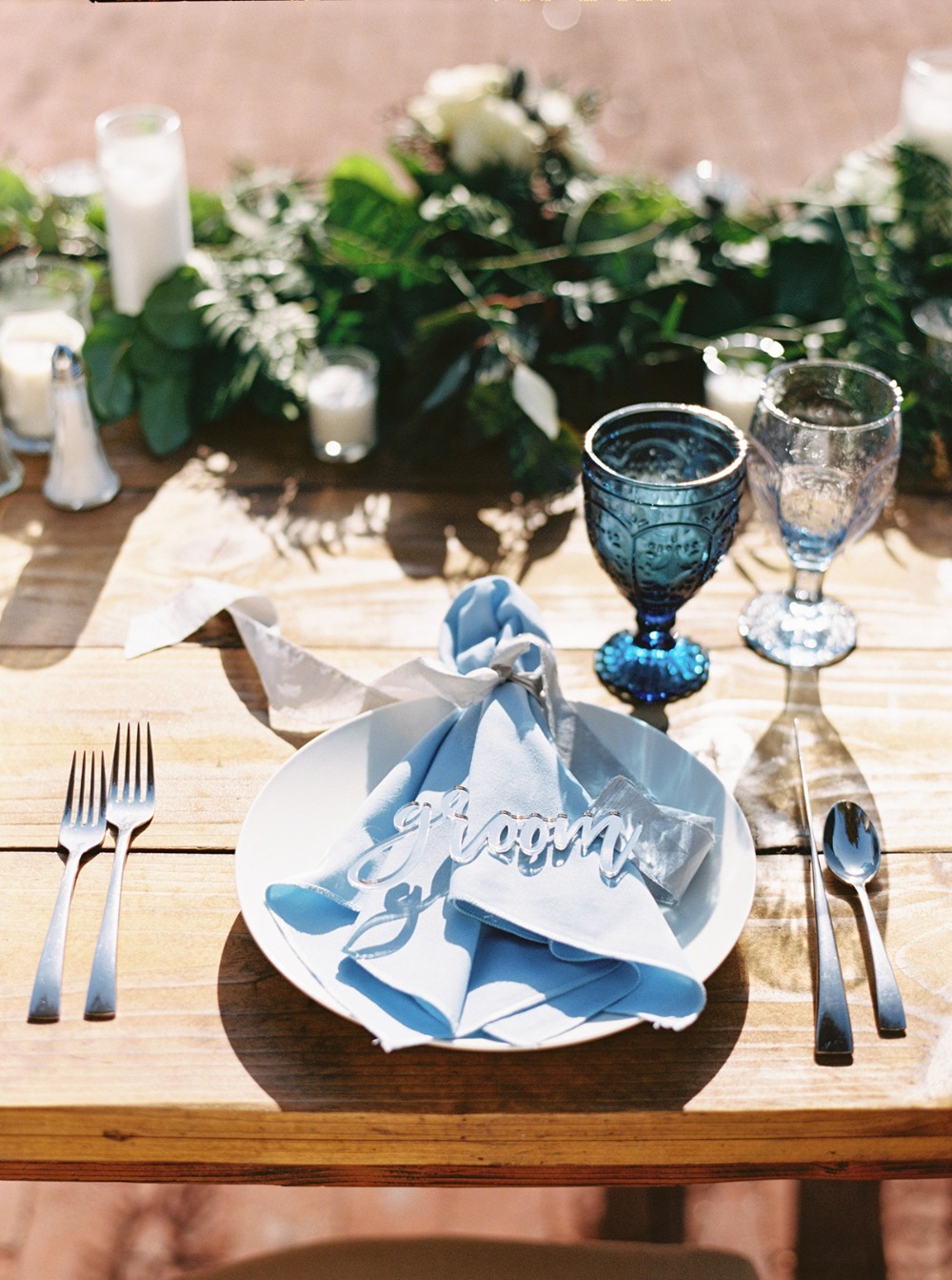 Wedding table setting groom place card blue accents