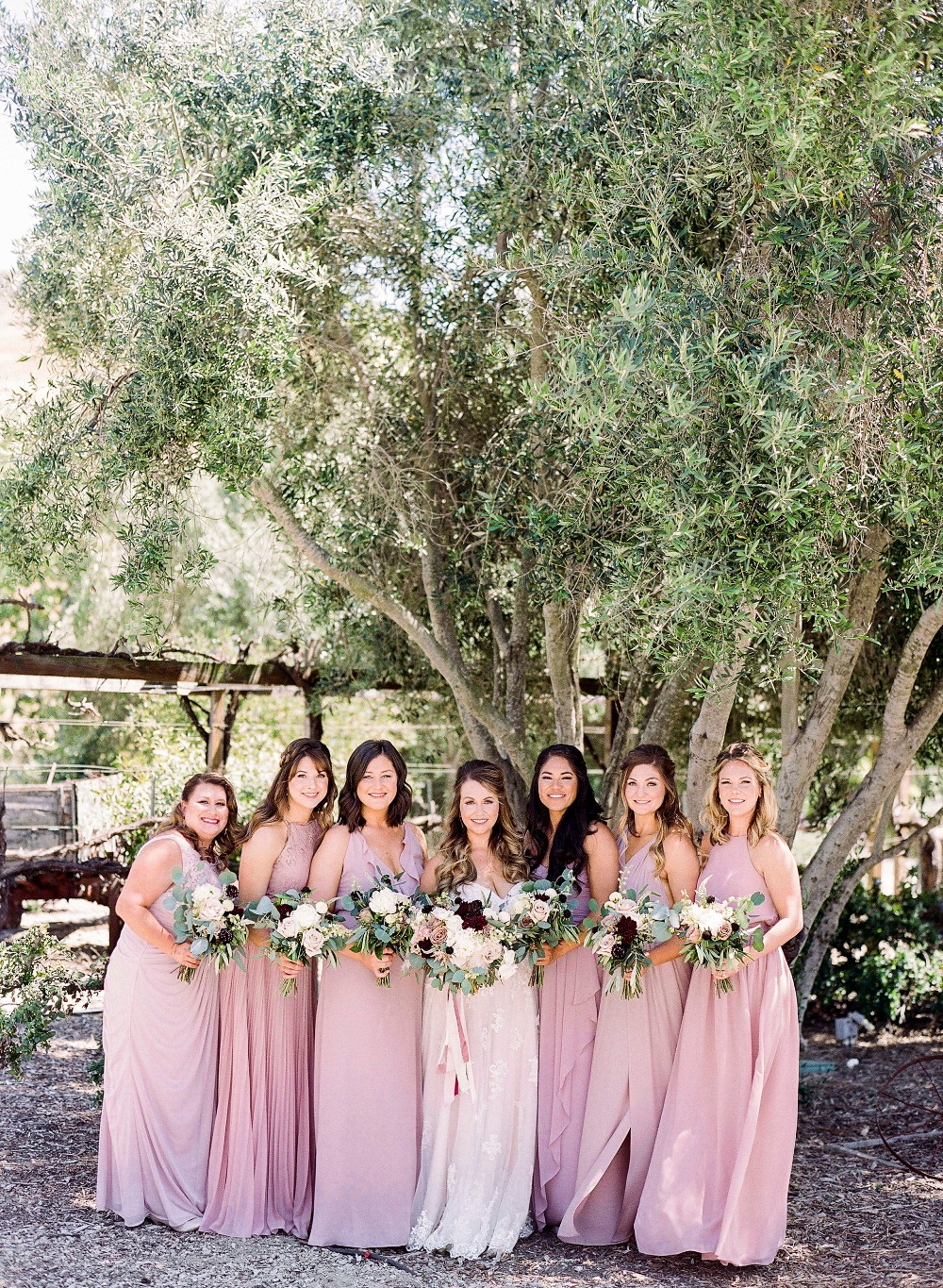bridesmaids in assorted pink 