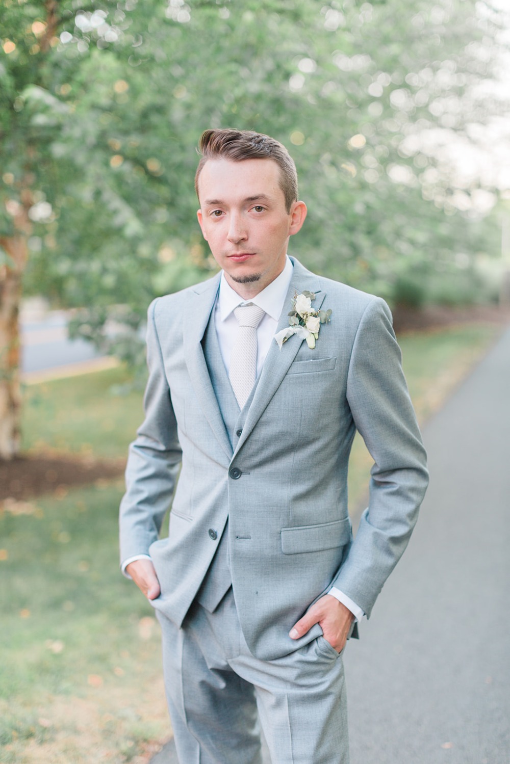 groom in light grey three piece suit
