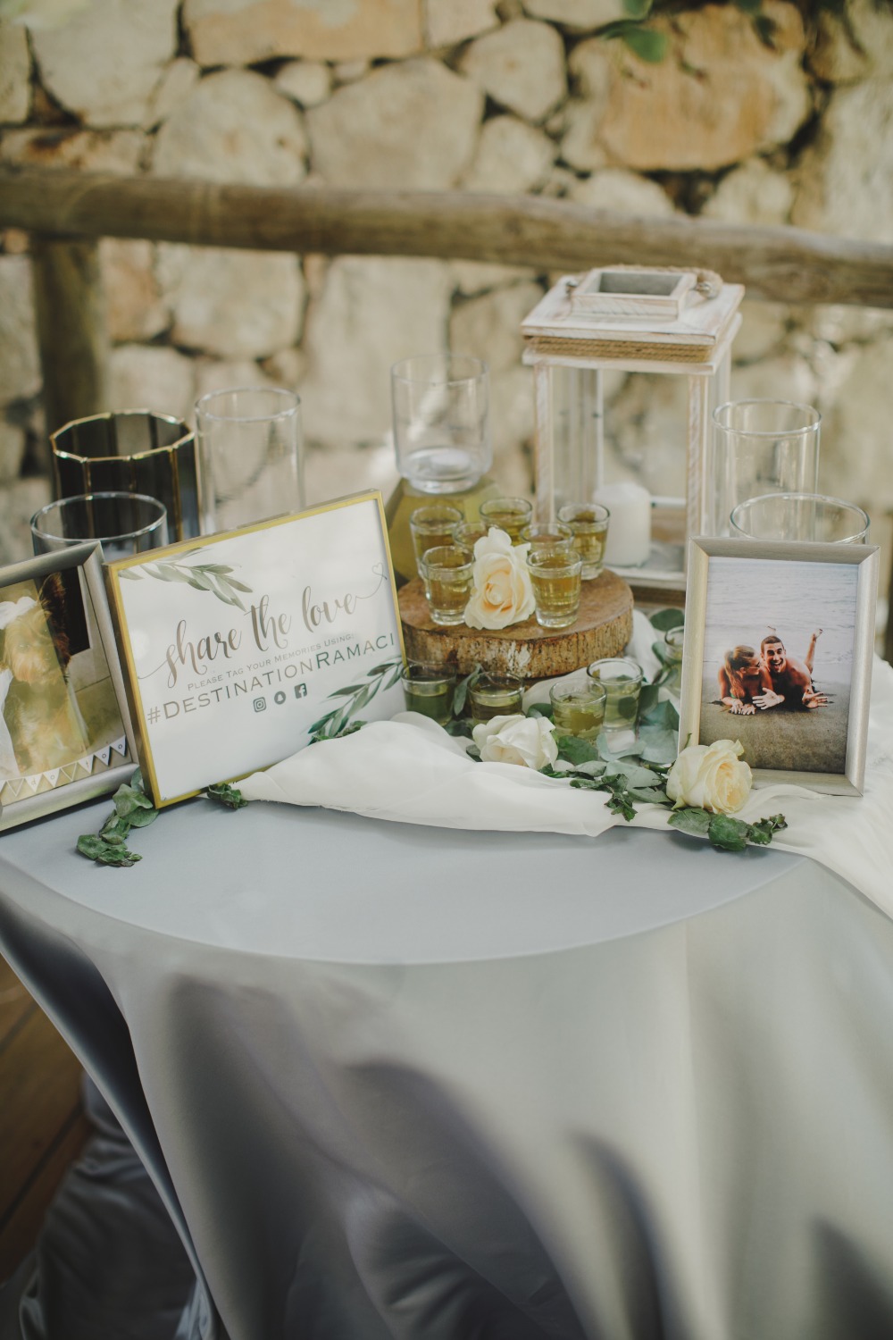 Wedding table decor with shots and share the love sign