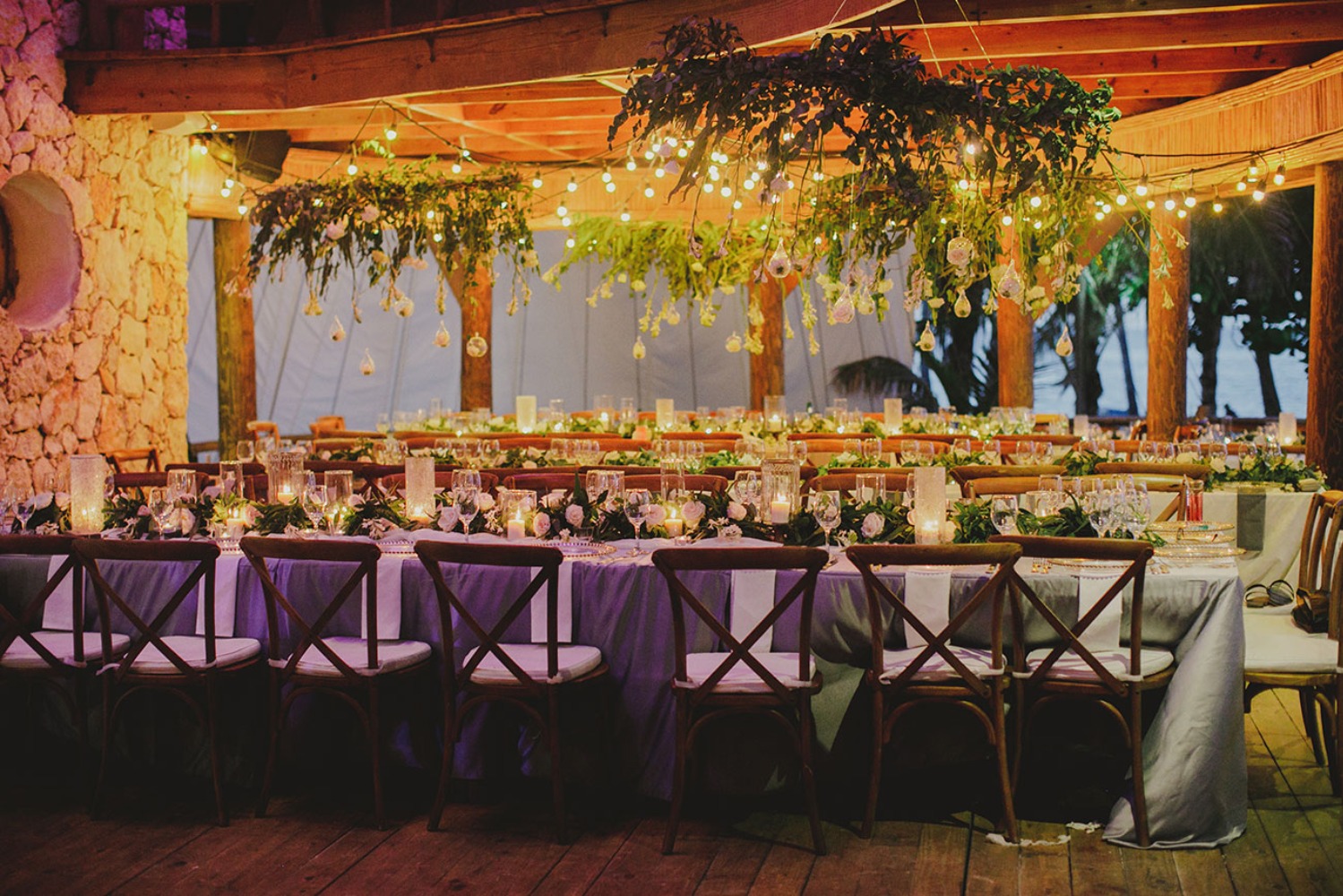 Elegant wedding reception with floral decor and soft lighting