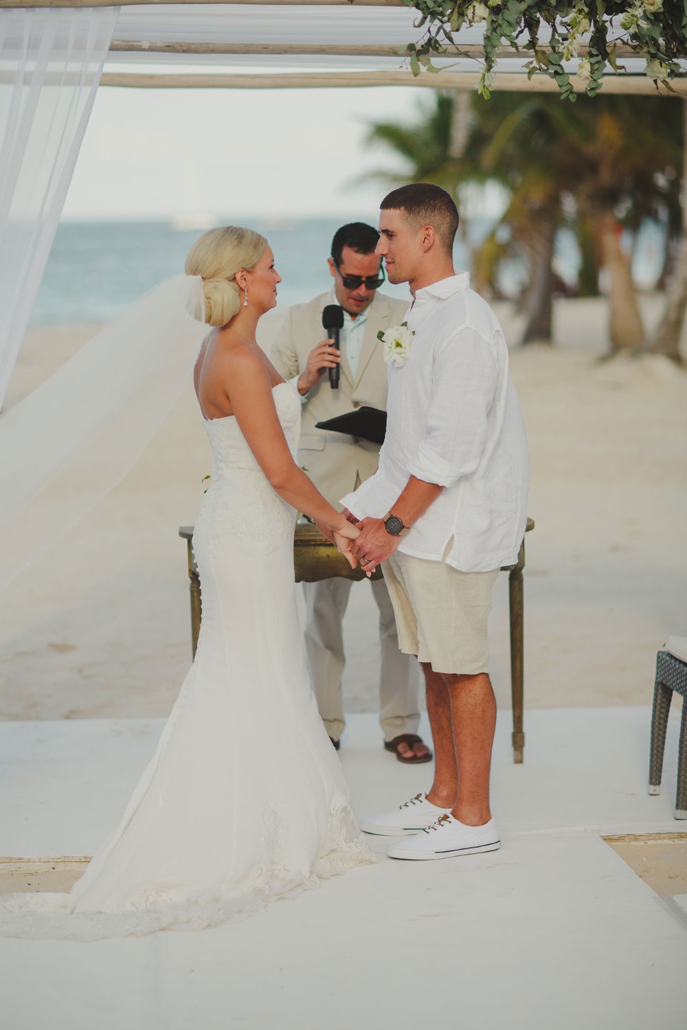 Beach wedding vows ceremony on a beautiful sunny day
