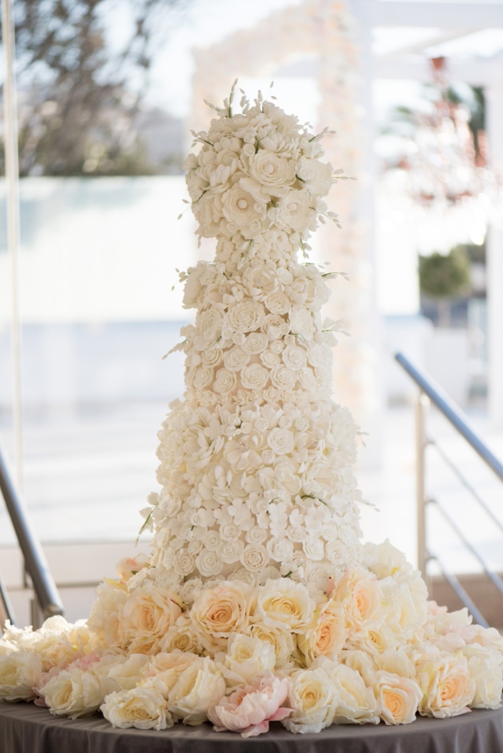 white flower covered cake