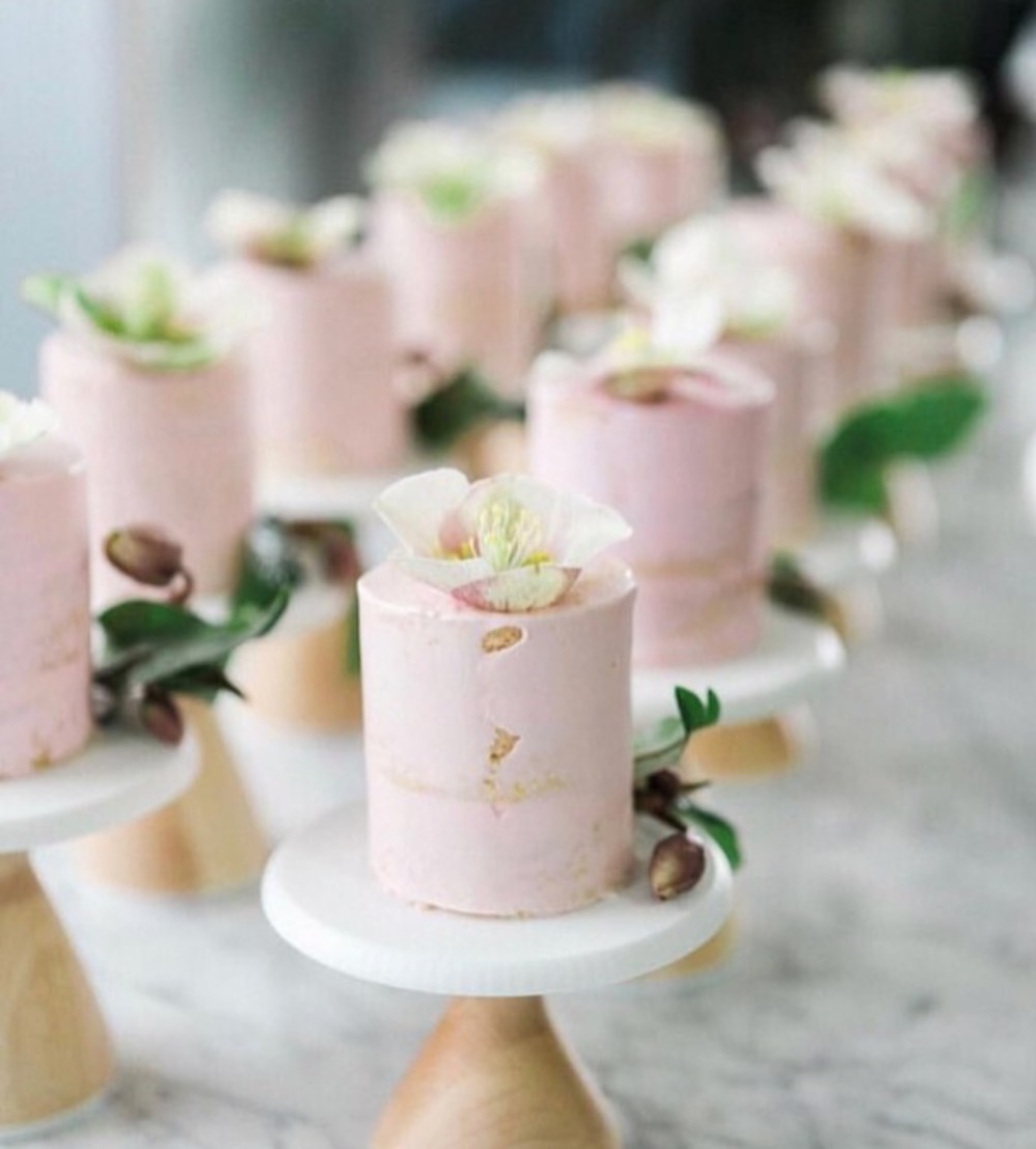 pink flower topped mini cakes by Cake Monkey Bakery