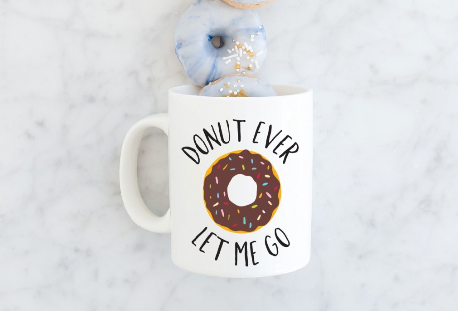 Donut Ever Let Me Go mug with donuts on marble table