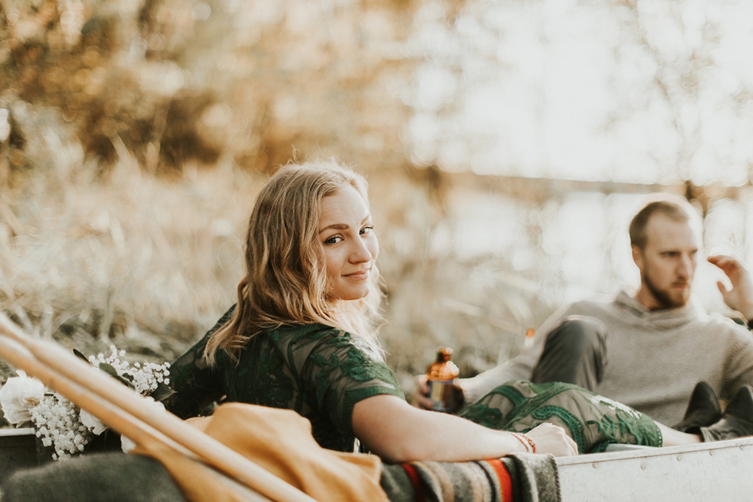Romantic couple in canoe enjoying golden hour light