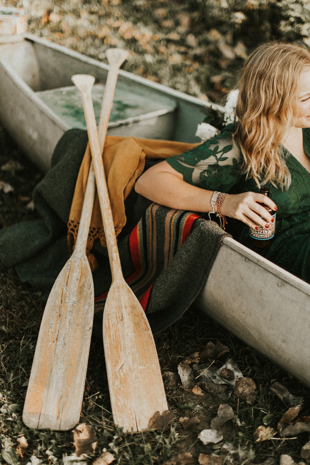 Autumn canoe trip woman paddles drink relaxing day