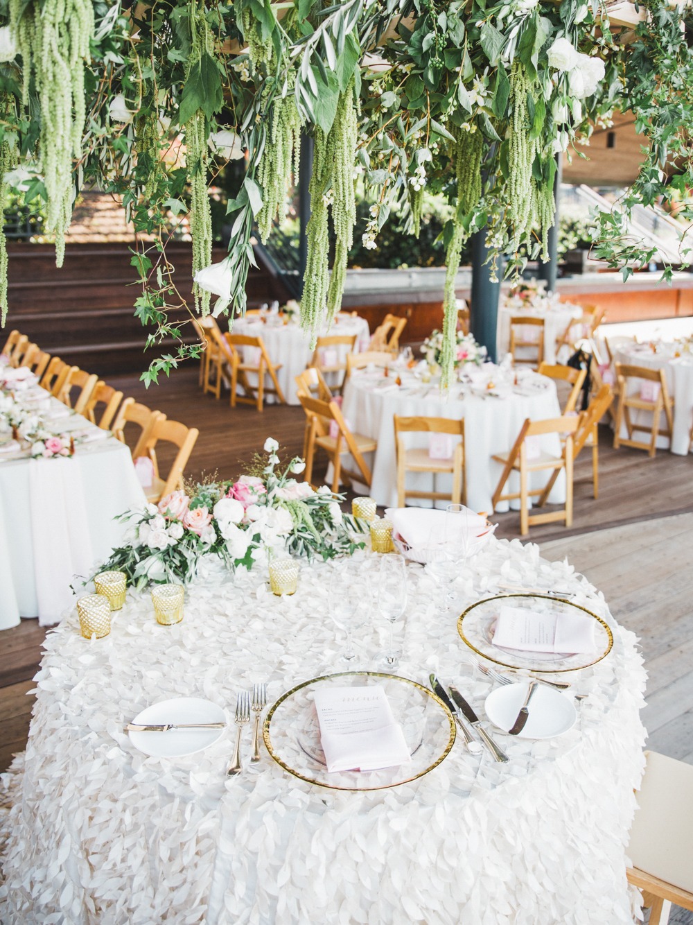 sweetheart table with cascading greenery chandelier