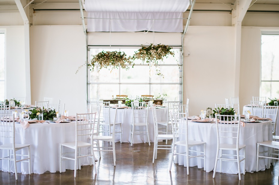 Whitewashed reception with greenery