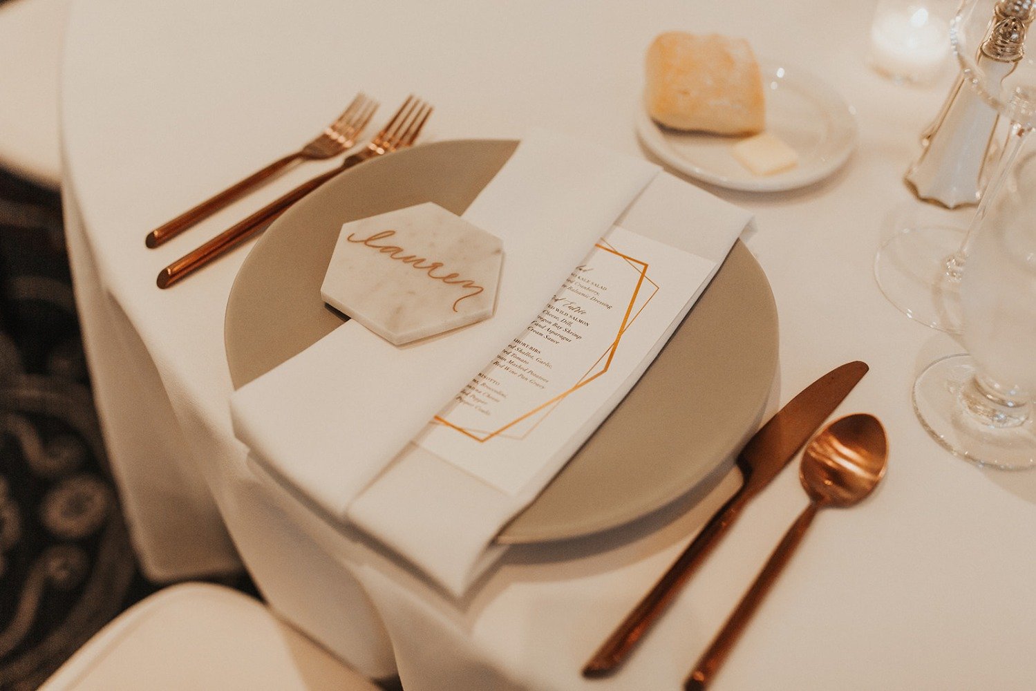 white and copper wedding place setting