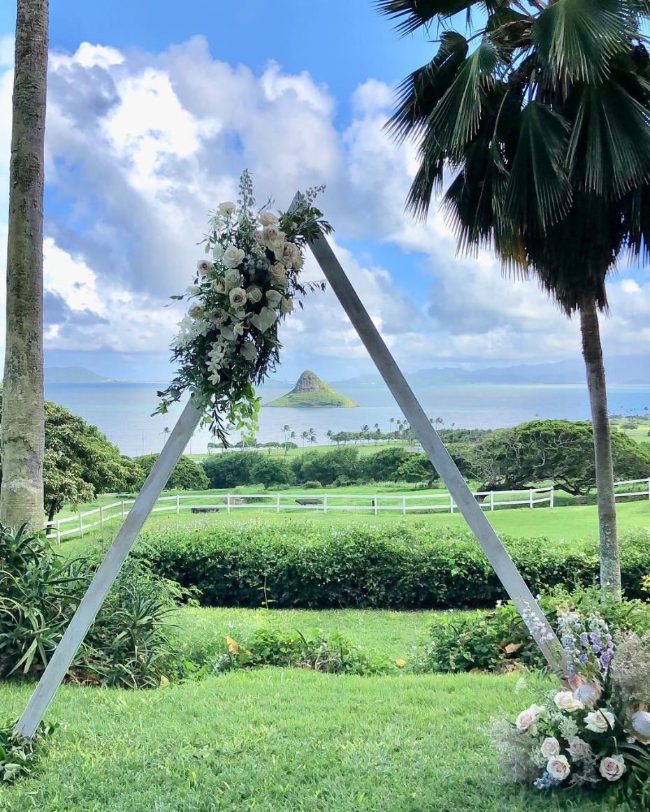 Hawaii wedding arch with ocean and island view