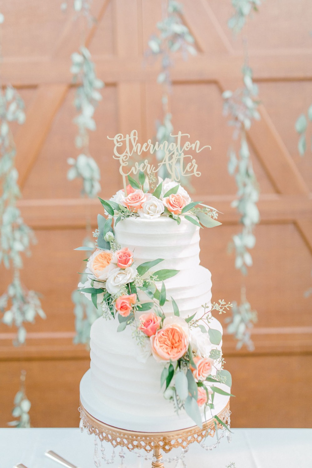 white wedding cake with cascading roses